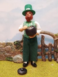 Leprechaun standing with pot of gold